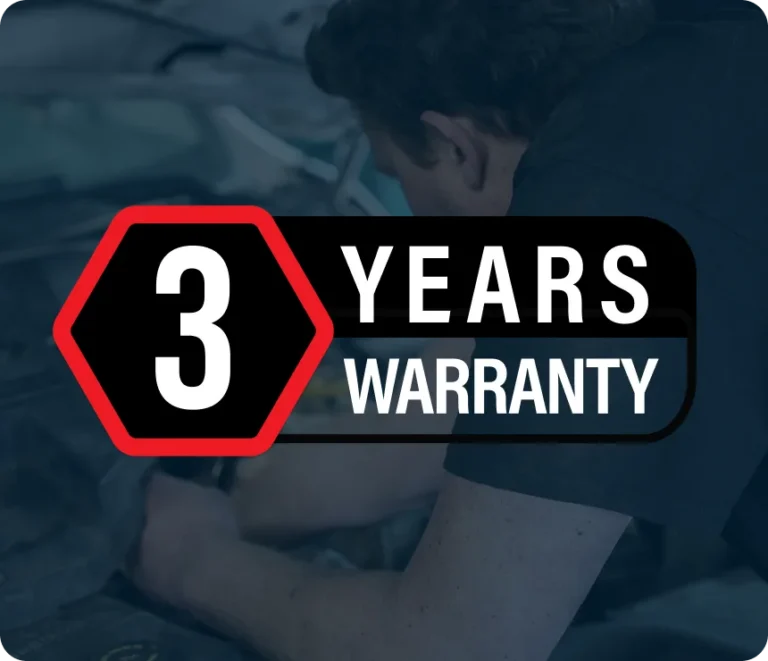 A person working on a car engine with a bold graphic overlay that reads 3 Years Warranty inside a red-outlined hexagon and black box.